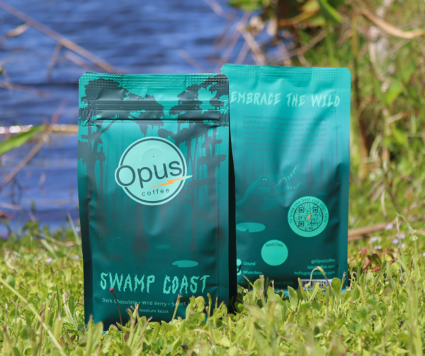Opus Coffee Swamp Coast pictured on the shore of a Florida lake.