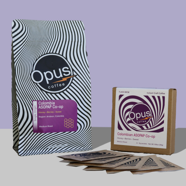 Colombia ASOPAP retail bag and Flash Brew 6 packet set displayed on a light purple background.