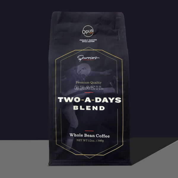 Opus Coffee Two-a-days blend in partnership with Spurrier's is a navy bag with "Two-A-Days Blend" in white.