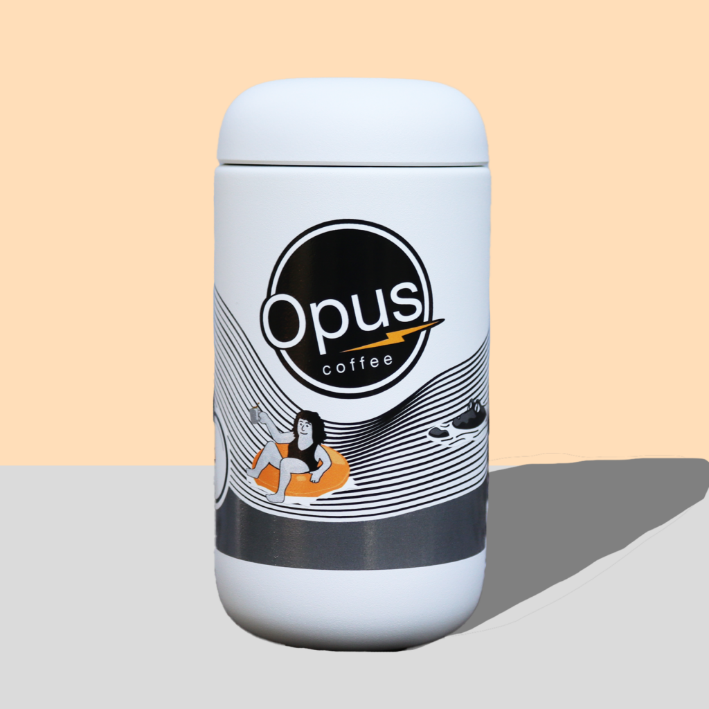 White travel mug with sealed lid and Opus Coffee Gainesville is home design