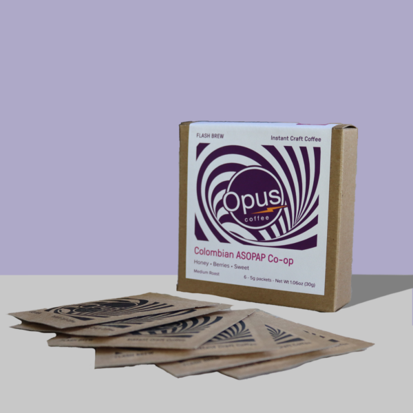 Opus Colombia ASOPAP Flash Brew 6 packet coffee on a lavender background.
