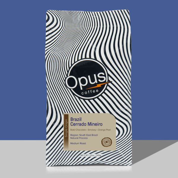 Single origin retail bag of Opus Coffee's Brazil Cerrado roast. It is in a retail bag with the Opus logo and a tan label.