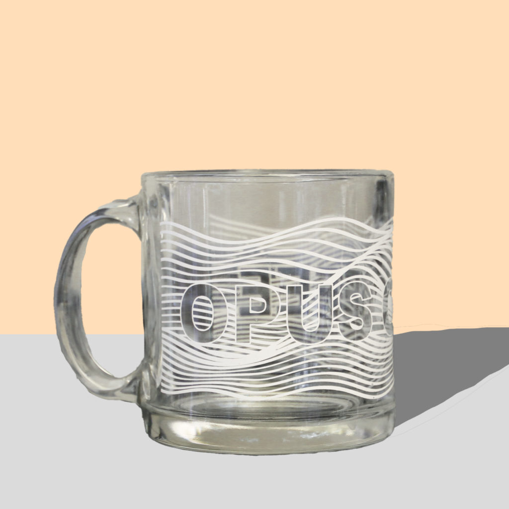 Clear mug with Opus Coffee and white wavy lines