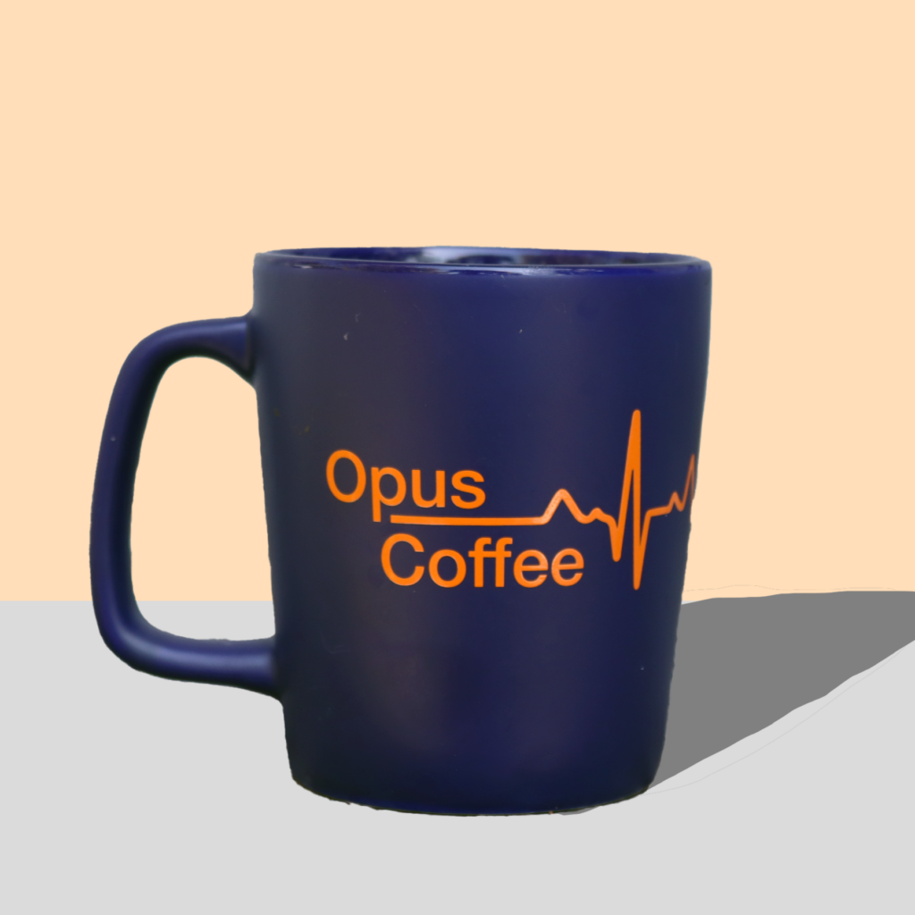 blue mug with heartbeat logo and Opus Coffee