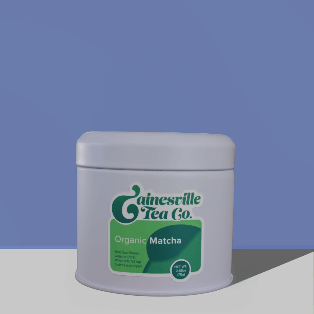 organic green matcha tea tin on blue background.